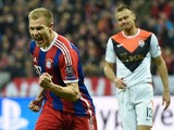 Bayern Munich's defender Holger Badstuber celebrates scoring the 5-0 goal during the UEFA Champions League second-leg, Round of 16 football match FC Bayern Munich vs Shakhtar Donetsk in Munich, southern Germany, on March 11, 2015