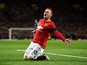 Wayne Rooney of Manchester United celebrates after scoring a goal to level the scores at 1-1 during the FA Cup Quarter Final match between Manchester United and Arsenal at Old Trafford on March 9, 2015