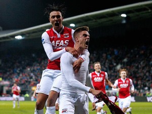 Markus Henriksen of AZ celebrates scoring the winning goal in the final minute of the game as Steven Berghuis jumps on his back during the Dutch Eredivisie match between AZ Alkmaar and SC Cambuur held at the AFAS Stadion on March 21, 2015