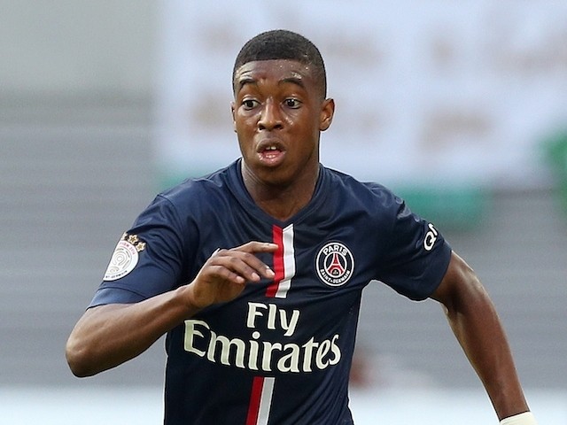 Paris Saint-Germain's defender Presnel Kimpembe runs with the ball during a friendly football match between German second division team RB Leipzig  on July 16, 2014