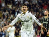 Real Madrid's Colombian midfielder James Rodriguez celebrates after scoring during the Spanish league football match Real Madrid CF vs Malaga FC at the Santiago Bernabeu stadium in Madrid on April 18, 2015