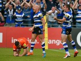 Bath players Peter Stringer and George Ford celebrate after Stringer had scored as Tommy Bell of the Tigers looks on during the Aviva Premiership semi final match between Bath Rugby and Leicester Tigers at Recreation Ground on May 23, 2015