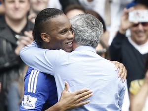 Chelsea's Portuguese manager Jose Mourinho hugs Chelsea's Ivorian striker Didier Drogba before the English Premier League football match between Chelsea and Sunderland at Stamford Bridge in London on May 24, 2015