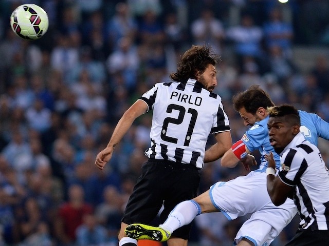 Lazio's defender from Romania Stefan Radu (C) scores during the Italian Tim Cup final match (Coppa Italia) between Juventus and Lazio on May 20, 2015