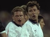 Bryan Robson #7 of England looks on as Paul Gascoigne (centre) of England sneers at the referee during the World Cup match against the Republic of Ireland in Cagliari, Italy. The match ended in a 1-1 draw