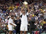 Goran Ivanisevic of Croatia lifts the Wimbledon trophy after beating Patrick Rafter of Australia during the Men's Final of The All England Lawn Tennis Championship at Wimbledon on July 9, 2001