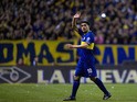 Boca Juniors' midfielder Juan Roman Riquelme waves while leaving the field during their Argentine First Division football match against Quilmes, at the Bombonera stadium in Buenos Aires, Argentina, on September 29, 2013