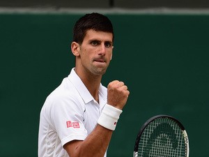 Novak Djokovic of Serbia celebrates winning a point in the Final Of The Gentlemen's Singles against Roger Federer of Switzerland on day thirteen of the Wimbledon Lawn Tennis Championships at the All England Lawn Tennis and Croquet Club on July 12, 2015