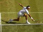 Roger Federer of Switzerland plays a backhand in the Gentlemens Singles Semi Final match against Andy Murray of Great Britain during day eleven of the Wimbledon Lawn Tennis Championships at the All England Lawn Tennis and Croquet Club on July 10, 2015