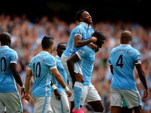 Raheem Sterling of Manchester City celebrates scoring his team's first goal with his team mates during the Barclays Premier League match between Manchester City and Watford at Etihad Stadium on August 29, 2015