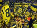 Dortmund's fans cheer their team during the German First division Bundesliga football match Borussia Dortmund vs Hannover 96 on October 25, 2014