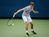 David Goffin of Belgium serves against Simone Bolelli of Italy during his Men's Singles First Round match on Day One of the 2015 US Open at the USTA Billie Jean King National Tennis Center on August 31, 2015