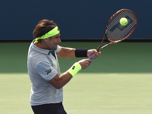 David Ferrer of Spain hits a shot against Filip Krajinovic of Serbia during their men's singles round two match during the 2015 US Open at the USTA Billie Jean King National Tennis Center September 2, 2015 in New York. AFP PHOTO / TIMOTHY A. CLARY (Photo 