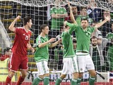 Hungary's defender Richard Guzmics (L) celebrates scoring the opening goal of the Euro 2016 qualifying group F football match between Northern Ireland and Hungary at Windsor Park in Belfast on September 7, 2015.