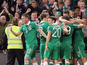 Republic of Ireland's players celebrate their first goal during the Euro 2016 qualifying group D football match between Republic of Ireland and Georgia at Aviva Stadium in Dublin on September 7, 2015. 