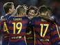 Barcelona's defender Marc Bartra (hidden) celebrates with Barcelona's Argentinian forward Lionel Messi (C) and teammates after scoring during the Spanish league football match FC Barcelona vs Levante UD at the Camp Nou stadium in Barcelona on September 20