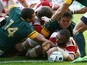 Japan's back row Michael Leitch (C) scores a try during a Pool B match of the 2015 Rugby World Cup between South Africa and Japan at the Brighton community stadium in Brighton, south east England on September 19, 2015