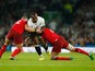  Tom Youngs (L) and Tom Wood of England (R) tackles Vereniki Goneva of Fiji during the 2015 Rugby World Cup Pool A match between England and Fiji at Twickenham Stadium on September 18, 2015 in London, United Kingdom. 