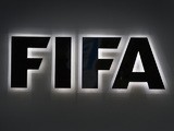 A photo shows the FIFA sign at the entrance of the world football's governing body headquarters in Zurich taken on September 25, 2015