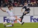 Partizan's Serbian striker Andrija Zivkovic (R) scores the first goal during the UEFA Europa League first-leg Group L football match FC Augsburg v FK Partizan in Augsburg, southern Germany on October 1, 2015
