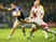 Adam Quinlan of St. Helens R.F.C pulls on Joel Moon of Leeds Rhinos during the First Utility Super League Semi Final between Leeds Rhinos and St Helens at Headingley Carnegie Stadium on October 2, 2015 in Leeds, England.