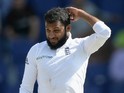 Adil Rashid of England reacts after being hit to the boundary during day two of the 1st Test between Pakistan and England at Zayed Cricket Stadium on October 14, 2015 in Abu Dhabi, United Arab Emirates.
