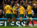 Kurtley Beale of Australia congratulates Drew Mitchell after he scored his teams second try during the 2015 Rugby World Cup Quarter Final match between Australia and Scotland at Twickenham Stadium on October 18, 2015 in London, United Kingdom.