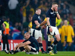 Finn Russell of Scotland reacts with team mates after the 2015 Rugby World Cup Quarter Final match between Australia and Scotland at Twickenham Stadium on October 18, 2015