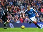 Martyn Waghorn of Rangers takes on Jake Pickard of Queen of the South during the Scottish Championship match between Glasgow Rangers FC and Queen of the South FC at Ibrox Stadium on October 17, 2015 