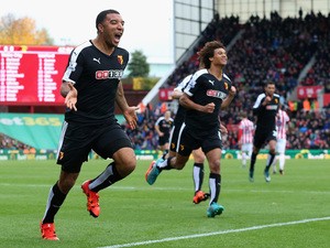 Troy Deeney of Watford celebrates scoring his team's first goal during the Barclays Premier League match between Stoke City and Watford at Britannia Stadium on October 24, 2015