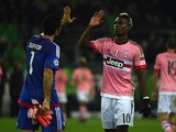 Juventus' goalkeeper Gianluigi Buffon and French midfielder Paul Pogba give high fives after the UEFA Champions League Group D, second-leg football match Borussia Moenchengladbach vs Juventus in Moenchengladbach, western Germany on November 3, 2015