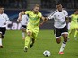 Gent's Belgian forward Laurent Depoitre (L) and Valencia's Brazilian defender Aderlan Santos vie for the ball during UEFA Champions League Group H second-leg football match between KAA Gent and Valencia CF at the KAA Gent Stadium in Ghent, Belgium on Nove