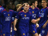 Manchester United's Wayne Rooney is congratulated after scoring against Sheffield United during their English Premiership football match at Bramall Lane, Sheffield, England, November 18 2006