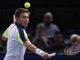 France's Nicolas Mahut returns the ball to Serbia's Dusan Lajovic during their first round tennis match at the ATP World Tour Masters 1000 indoor tennis tournament in Paris on November 2, 2015