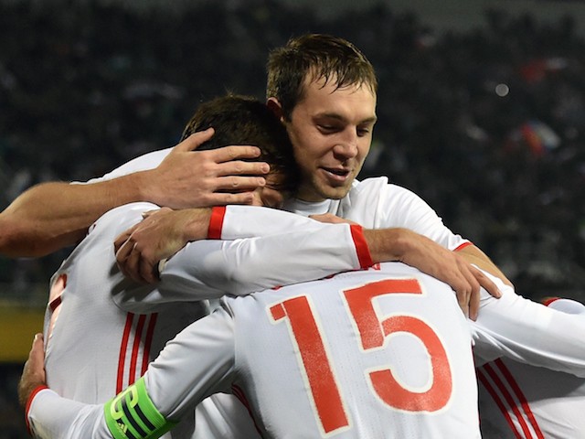 Russia's forward Artem Dzyuba (C) and teammates celebrate a goal during the friendly football match between Russia and Portugal in Krasnodar on November 14, 2015.