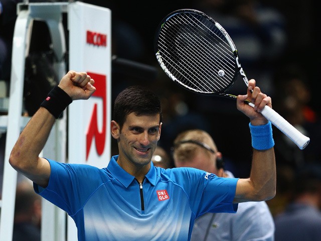 Novak Djokovic of Serbia celebrates victory after his men's singles match against Kei Nishikori of Japan during day one of the Barclays ATP World Tour Finals at O2 Arena on November 15, 2015