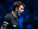 Switzerland's Stan Wawrinka celebrates winning the first set against Britain's Andy Murray during a men's singles group stage match on day six of the ATP World Tour Finals tennis tournament in London on November 20, 2015.