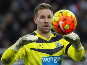 Newcastle United's English-born Irish goalkeeper Rob Elliot gathers the ball during the English Premier League football match between Newcastle United and Leicester City at St James' Park in Newcastle-upon-Tyne, north east England, on November 21, 2015. L