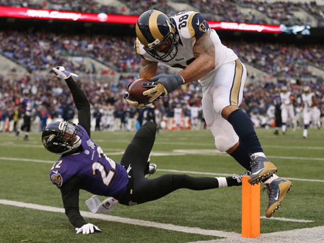 Tight end Lance Kendricks #88 of the St. Louis Rams scores a third quarter touchdown past cornerback Jimmy Smith #22 of the Baltimore Ravens at M&T Bank Stadium on November 22, 2015
