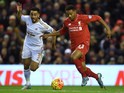 Liverpool's English midfielder Jordon Ibe (R) vie with Swansea City's Welsh defender Neil Taylor during the English Premier League football match between Liverpool and Swansea City at the Anfield stadium in Liverpool, north-west England on November 29, 20