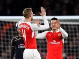 Mesut Ozil of Arsenal (r) celebrates scoring his side's first goal with Per Mertesacker of Arsenal during the UEFA Champions League match between Arsenal FC and GNK Dinamo Zagreb at Emirates Stadium on November 24, 2015