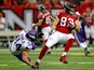 Jacob Tamme #83 of the Atlanta Falcons spins away from Andrew Sendejo #34 of the Minnesota Vikings after a catch during the first half at the Georgia Dome on November 29, 2015