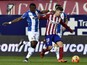 Atletico Madrid's Argentinian forward Luciano Vietto (R) vies with Espanyol's Senegalese midfielder Pape Diop during the Spanish league football match Club Atletico de Madrid vs RCD Espanyol at the Vicente Calderon stadium in Madrid on November 28, 2015.