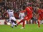 Christian Benteke of Liverpool shoots past Henri Saivet of Bordeaux as he scores their second goal during the UEFA Europa League Group B match between Liverpool FC and FC Girondins de Bordeaux at Anfield on November 26, 2015 in Liverpool, United Kingdom.