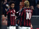 Luiz Adriano (L) of AC Milan celebrates with his team-mate Keisuke Honda (R) after scoring the opening goal during the TIM Cup match between AC Milan and FC Crotone at Stadio Giuseppe Meazza on December 1, 2015 in Milan, Italy.