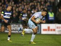 Luther Burrell of Northampton breaks away from Jonathan Joseph to score an interception try during the Aviva Premiership match between Bath and Northampton Saints at the Recreation Ground on December 5, 2015