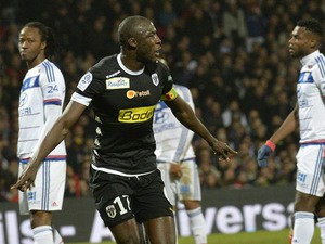 Angers' Senegalese midfielder Cheikh N'Doye celebrates after scoring a goal during the French L1 football match Lyon (OL) vs Angers (SCO) on December 5, 2015