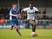 Joe Dodoo of Bury beats Donal McDermott of Rochdale during The Emirates FA Cup Second Round match between Rochdale and Bury at Spotland on December 6, 2015 in Rochdale, England.