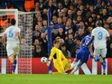 The ball rebounds off Porto's Spanish goalkeeper Iker Casillas (3R) as he saves a shot from Chelsea's Brazilian-born Spanish striker Diego Costa (2R) to hit Porto's Spanish defender Ivan Marcano (L) and ricochet into the goal for an own goal during the UE