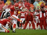 Cairo Santos #5 of the Kansas City Chiefs kicks a field goal from the hold of teammate Dustin Colquitt #2 at Arrowhead Stadium during the second quarter of the game against the San Diego Chargers on December 13, 2015